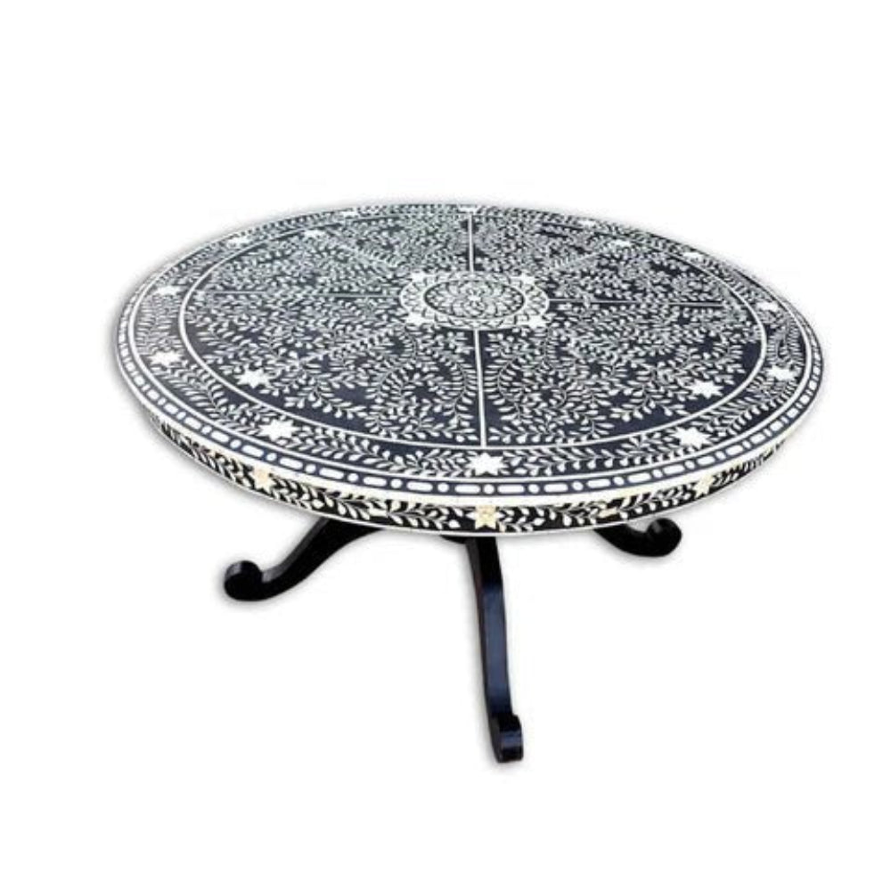 Artisan bone inlay round dining table showing full mandala inlay surface and dark wood pedestal legs against white background