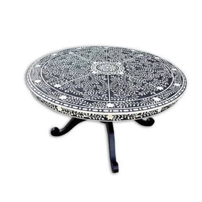 Artisan bone inlay round dining table showing full mandala inlay surface and dark wood pedestal legs against white background