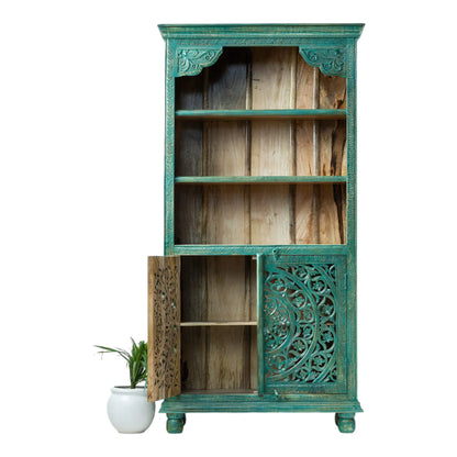 Mandala door storage cabinet in teal wood, front view with the left door open to reveal the lower shelf.