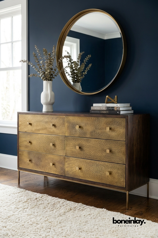 Handcrafted brass embossed six drawer dresser with textured metal drawer fronts, solid wood frame, slim brass legs, and luxurious bedroom storage cabinet.