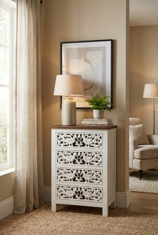 Rustic peacock accent chest in mango wood, styled in living room with a table lamp, books, and a potted fern.