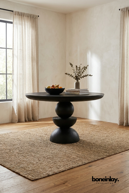 Modern black round pedestal dining table with sculptural base, contemporary wood dining table for modern home interior