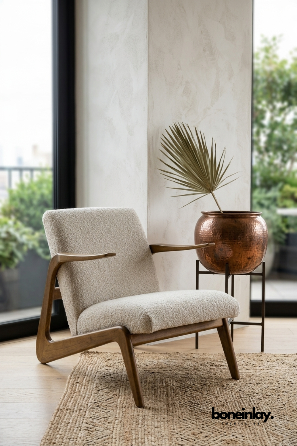 Modern wooden lounge chair with curved solid wood frame and soft cream boucle upholstery, handcrafted accent chair for contemporary living room, reading corner, or bedroom.
