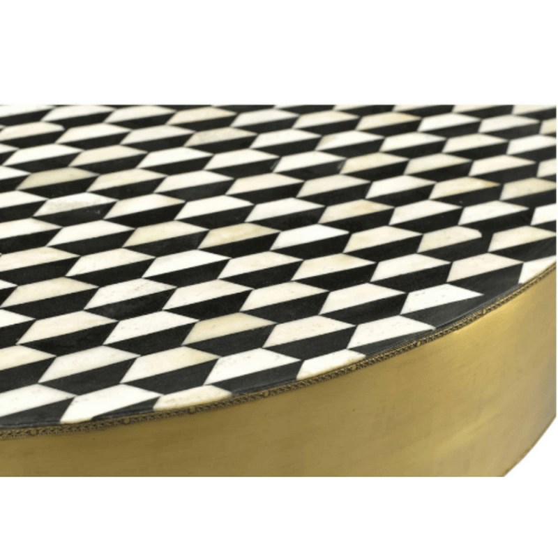 Close-up view of the black and white checkerboard bone inlay round coffee table, focusing on the geometric diamond mosaic surface, gold metal rim, and matte black pedestal base while highlighting the handcrafted inlay construction.
