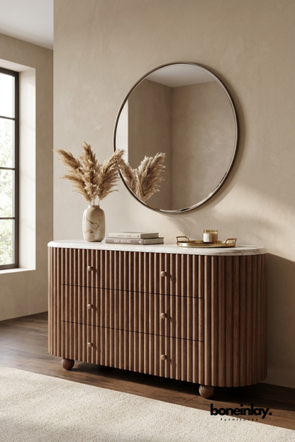 Modern fluted wood dresser with rounded corners, marble top, six drawers, and warm walnut finish, handcrafted bedroom storage chest with contemporary minimalist design.
