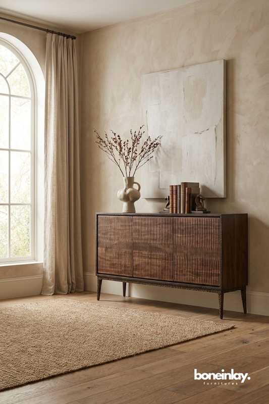 Modern ribbed wood sideboard featuring textured panel doors and mid century inspired silhouette.