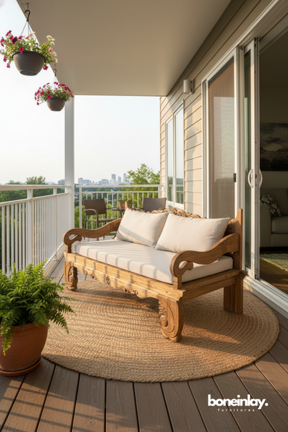 Handcrafted solid wood bench with upholstered cushions on a modern balcony terrace.