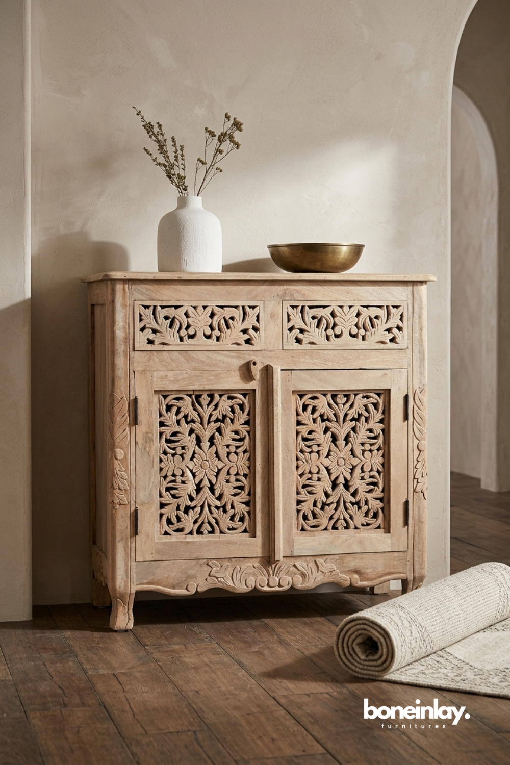 Hand carved solid wood storage cabinet with intricate floral carved doors, two drawers, and natural wood finish for living room or entryway.