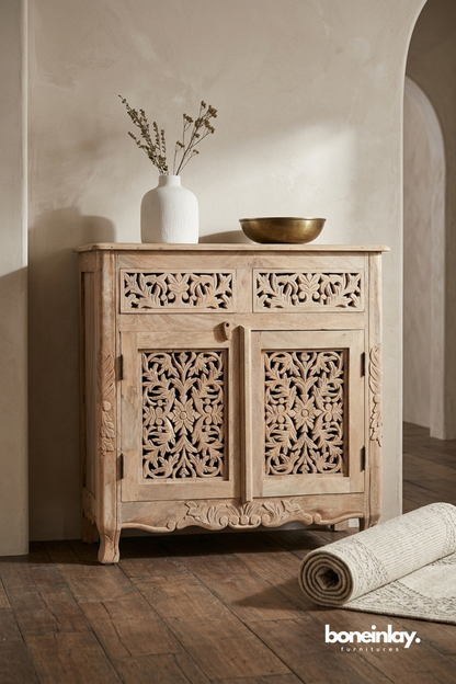 Hand carved solid wood storage cabinet with intricate floral carved doors, two drawers, and natural wood finish for living room or entryway.