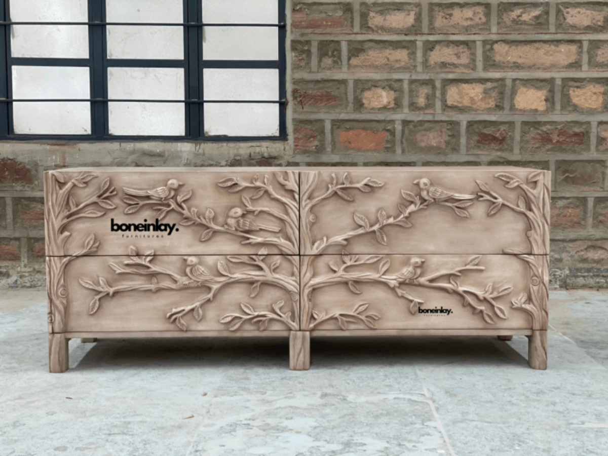 Natural Wood Bureau with carved bird and branch motifs, front view showing the full four-drawer face and short legs.