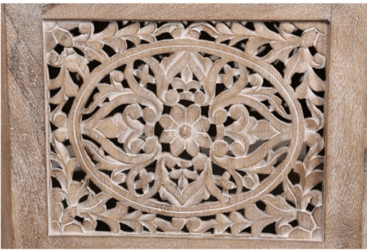 Natural Wood Center Table, close-up of the intricate floral carving across one framed side panel in a pale finish.