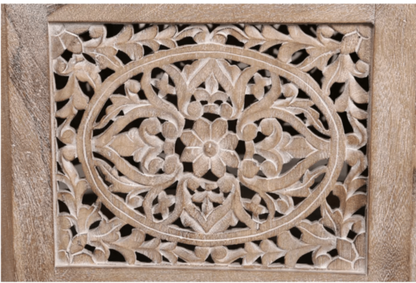 Natural Wood Center Table, close-up of the intricate floral carving across one framed side panel in a pale finish.