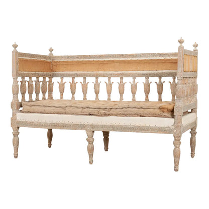 Natural wood settee with a cushioned seat, back view showing the rear rails and legs of the full piece.