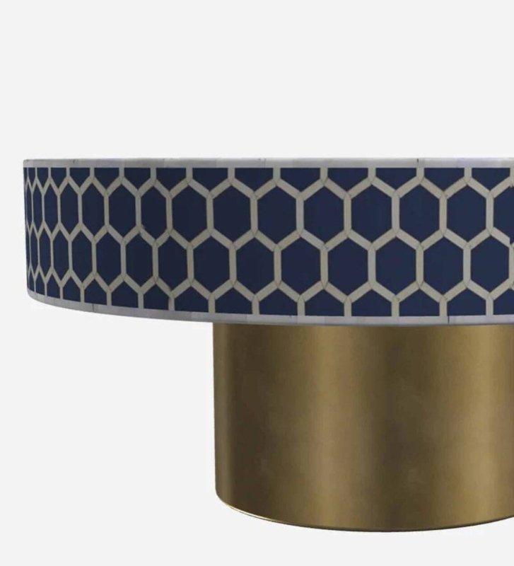 Close detail of navy blue geometric hexagon bone inlay pattern on round coffee table with brushed brass base – artisan handcrafted solid wood piece