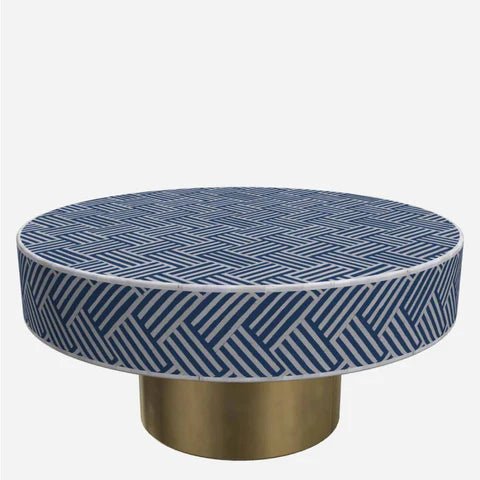 Navy blue and white herringbone bone inlay round coffee table on solid brass cylindrical base – handmade artisan furniture on white background