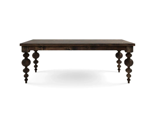 A luxury hand-carved solid wood dining table in a dark espresso finish featuring large sculptural orb-and-spindle turned legs.