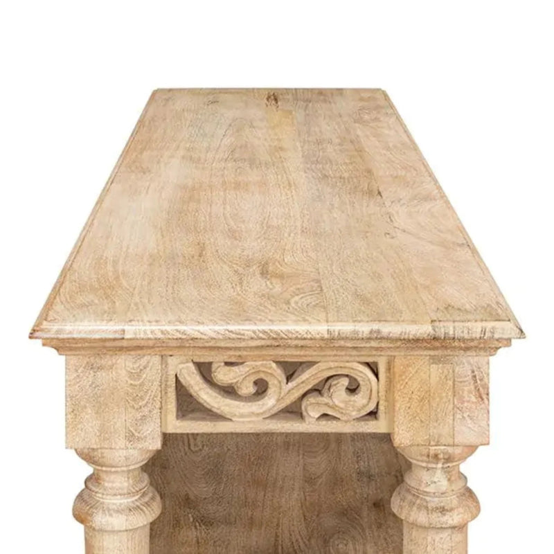 Open-shelf display table in natural bleached wood, top-down view of the carved tabletop against a neutral background.