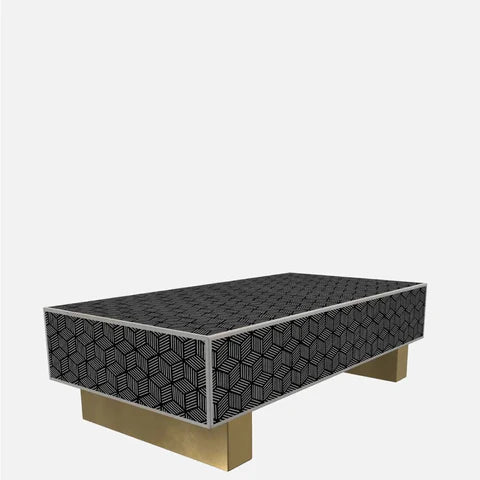 Three-quarter angle view of Optical Cube Monochrome Bone Inlay Coffee Table showing geometric cube pattern on top and sides with brass legs.