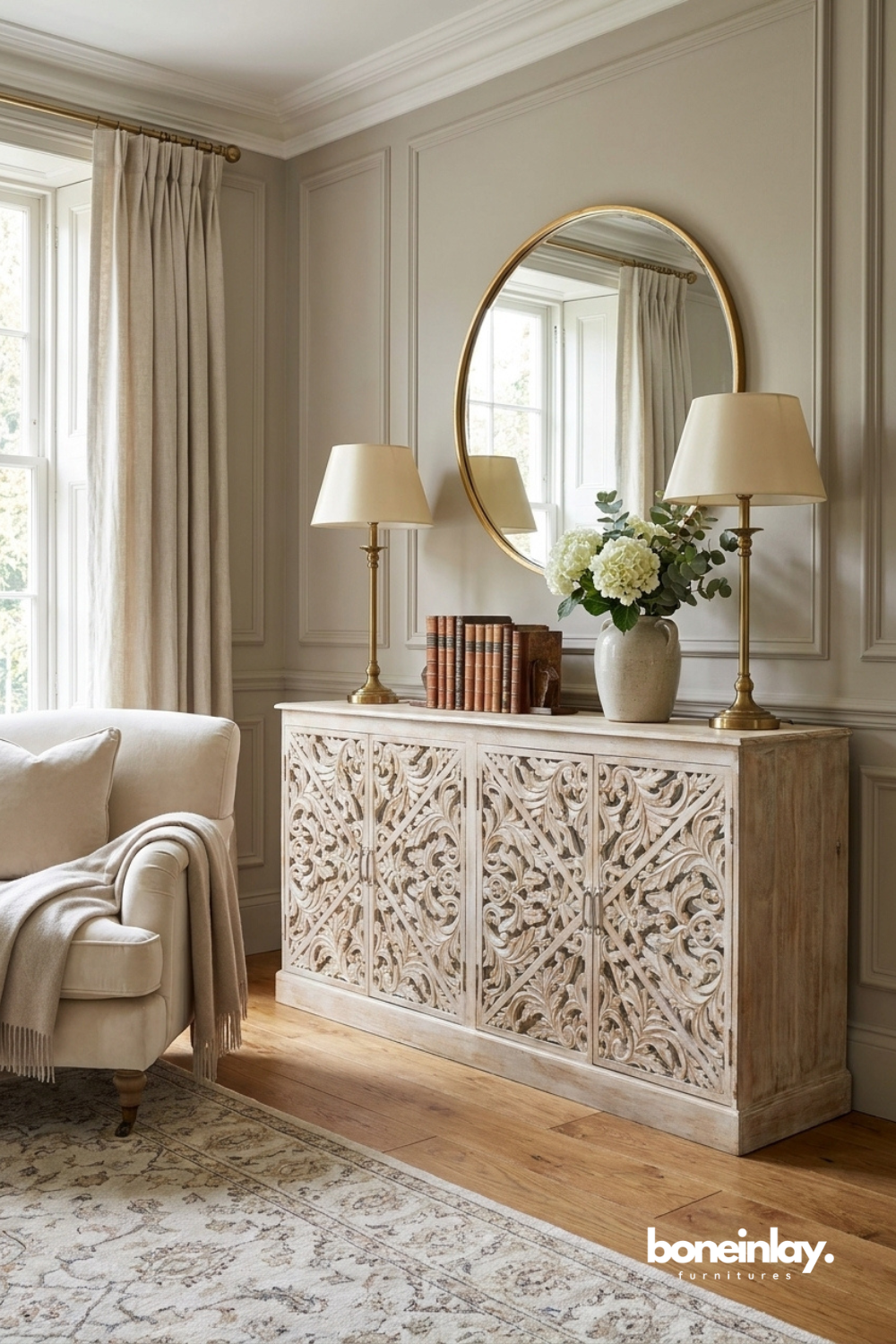 Whitewashed carved sideboard with intricate botanical motifs and four door storage.