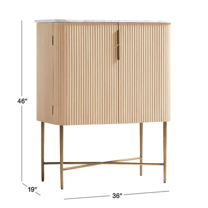 Rectangular marble top liquor cabinet in a front three-quarter view, highlighting fluted doors and brass legs.