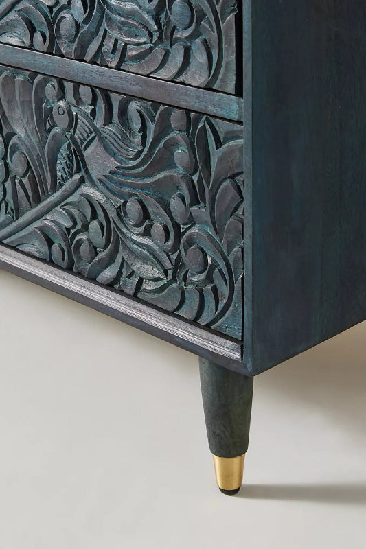 Close-up of a leg on the Gulliver wood dresser, showing how it supports the six-drawer cabinet above.