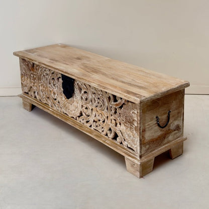 Rectangular wooden hope chest in rustic solid wood, angled front and side view showing the lid and black side handle.