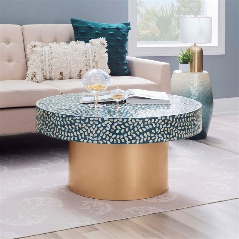 Round teal MOP inlay coffee table with shimmering white leaf pattern and gold brass pedestal base