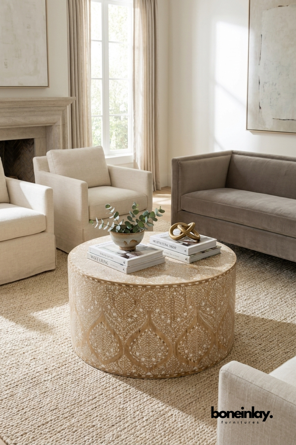 Round floral bone inlay coffee table in a light-filled living room, handcrafted artisan furniture, sophisticated luxury statement piece.