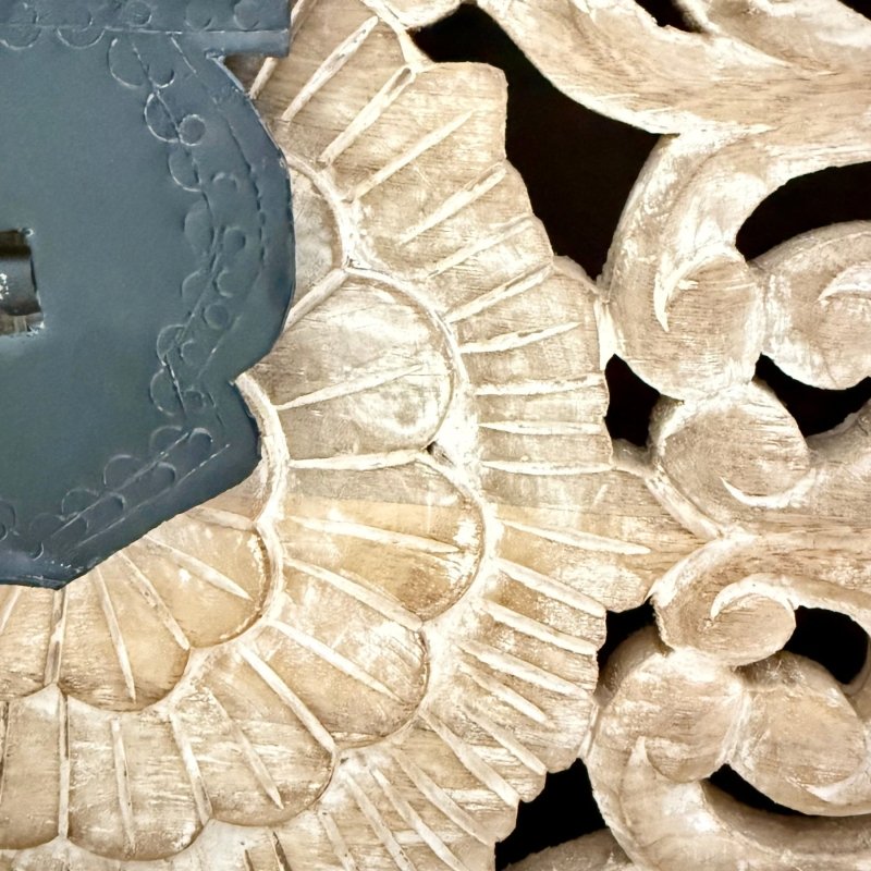 Hand-carved solid wood coffer with a rustic finish, close-up of floral carving detail beside the patterned black latch.