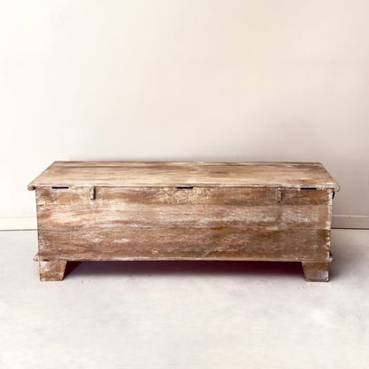 Rustic rectangular storage box in solid wood, back view showing the plain rear panel, lid hinges and two block feet.