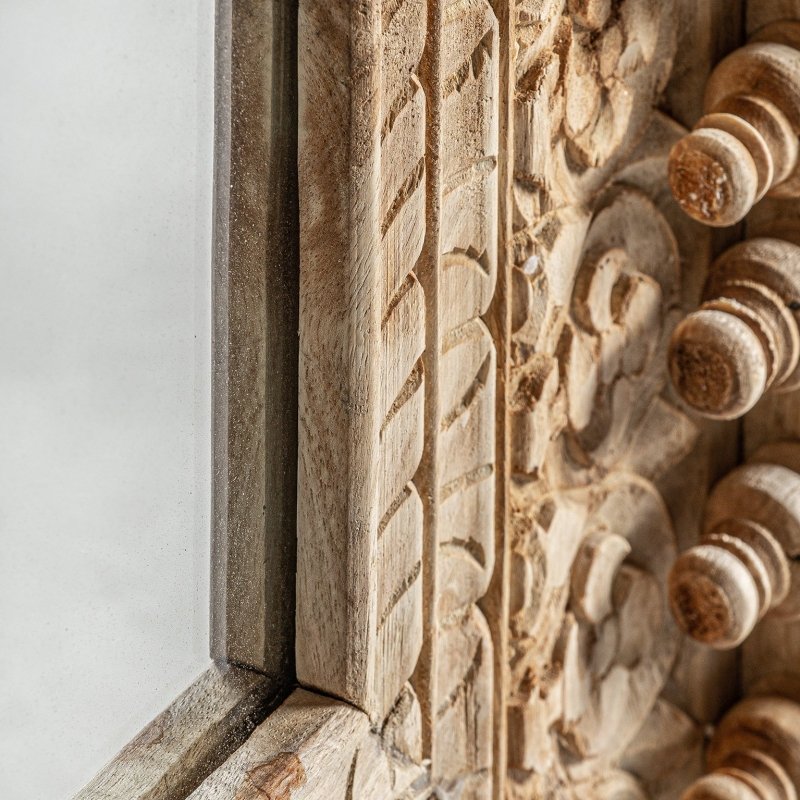 Rustic wood framed mirror in solid timber, edge detail view showing the recessed glass border and projecting carvings.