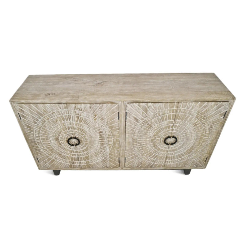 Rustic wood sideboard with medallion doors and short feet, viewed from above at an angle against white.