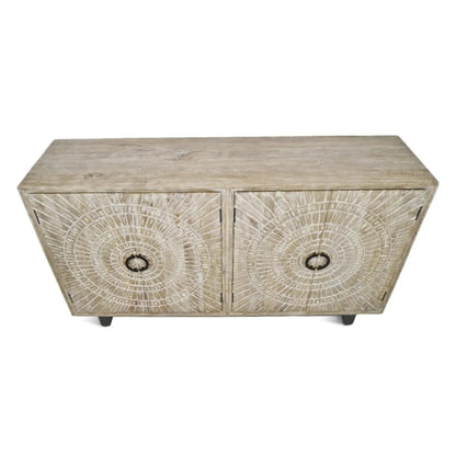 Rustic wood sideboard with medallion doors and short feet, viewed from above at an angle against white.