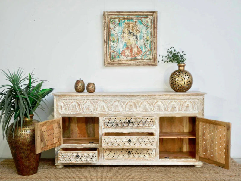 White wood storage buffet with open cabinet doors revealing natural wood interiors, shown from the front with decor.