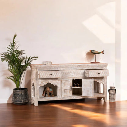 Scalloped Arch Server in distressed white wood, styled in a living room with open alcoves flanking the cabinet.