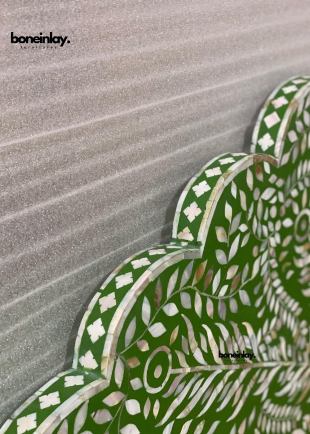 Scalloped edge of Green Headboard showing layered mother of pearl geometric and floral inlay work with handcrafted wooden border detail