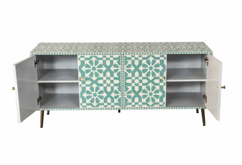 Full view of seafoam green geometric bone inlay credenza with four panelled doors, brass hardware knobs, and slim tapered legs