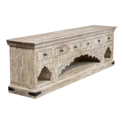 Solid wood arched buffet with a rustic finish, angled front view showing closed carved drawers and open lower shelving.