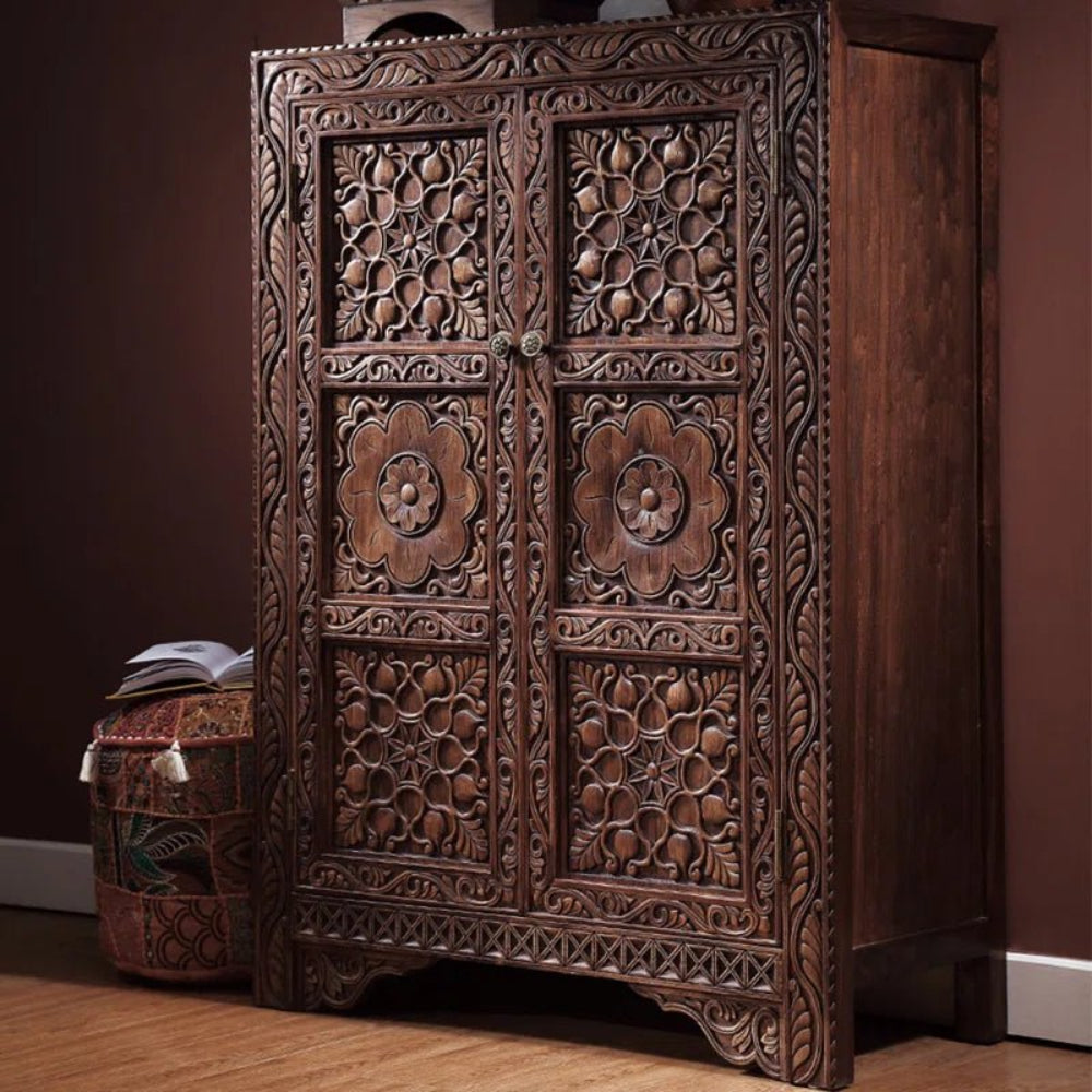 Solid wood double door wardrobe in brown, front view showing floral carved panels, paired knobs and the right side.