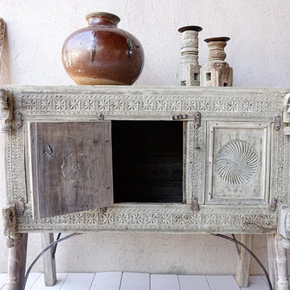 Solid wood dowry chest with a weathered neutral finish, front view with the central door open to reveal dark storage.