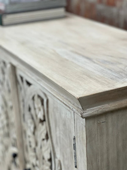 Molded top wood sideboard in a rustic finish, corner detail view showing the beveled top, layered trim and side panel.