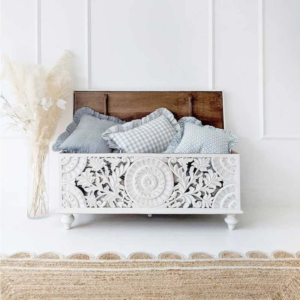 Solid Wood Storage Trunk in white, front view with its lid raised, revealing a brown wood underside and stored cushions.