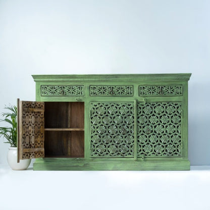 Solid wood carved  storage buffet in sage green, front view with the left door open to reveal a natural wood interior shelf.