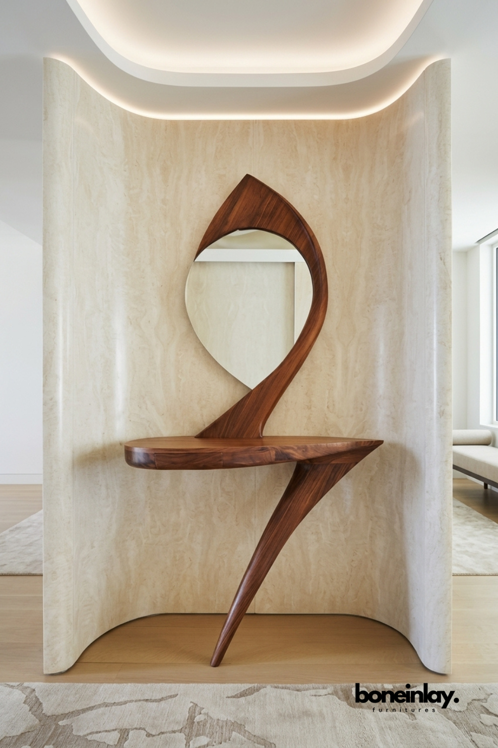 Sculptural solid walnut console table featuring a dramatic curved silhouette and integrated round mirror. Designed as a striking artistic statement piece within a curved travertine wall niche. Rich wood grain and fluid organic form showcase premium craftsmanship. A bespoke entryway console table for luxury and designer interior spaces.