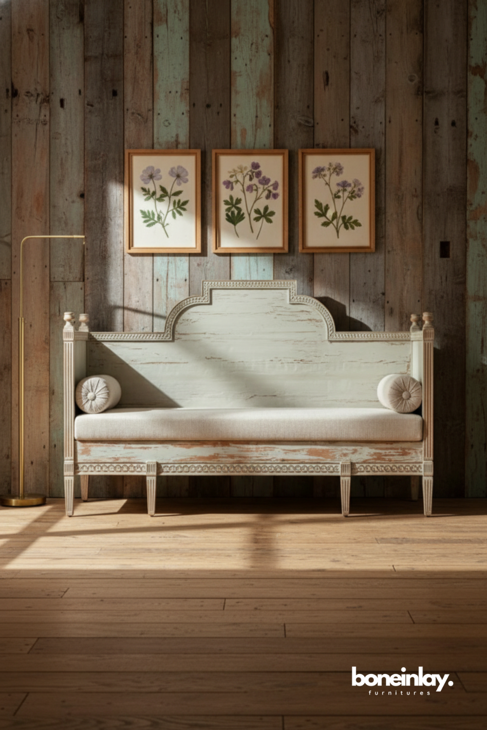 Distressed carved wooden bench with upholstered seat and vintage detailing.