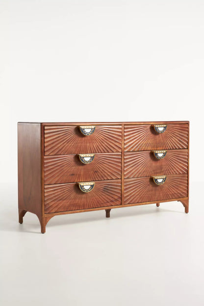 Tapered Leg Credenza in walnut wood is shown from the front left, revealing its side panel, six drawers, and brass pulls.