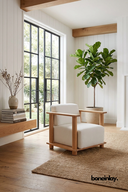 Modern solid wood accent chair with ivory upholstered cushions, minimalist lounge chair featuring clean architectural wooden frame.