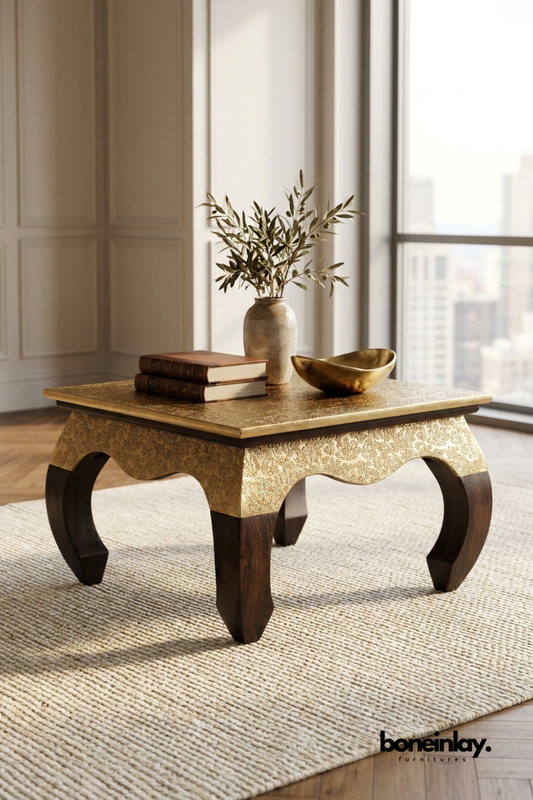 Gold embossed Accent Table with carved detailing and dark wooden curved legs in a modern interior setting