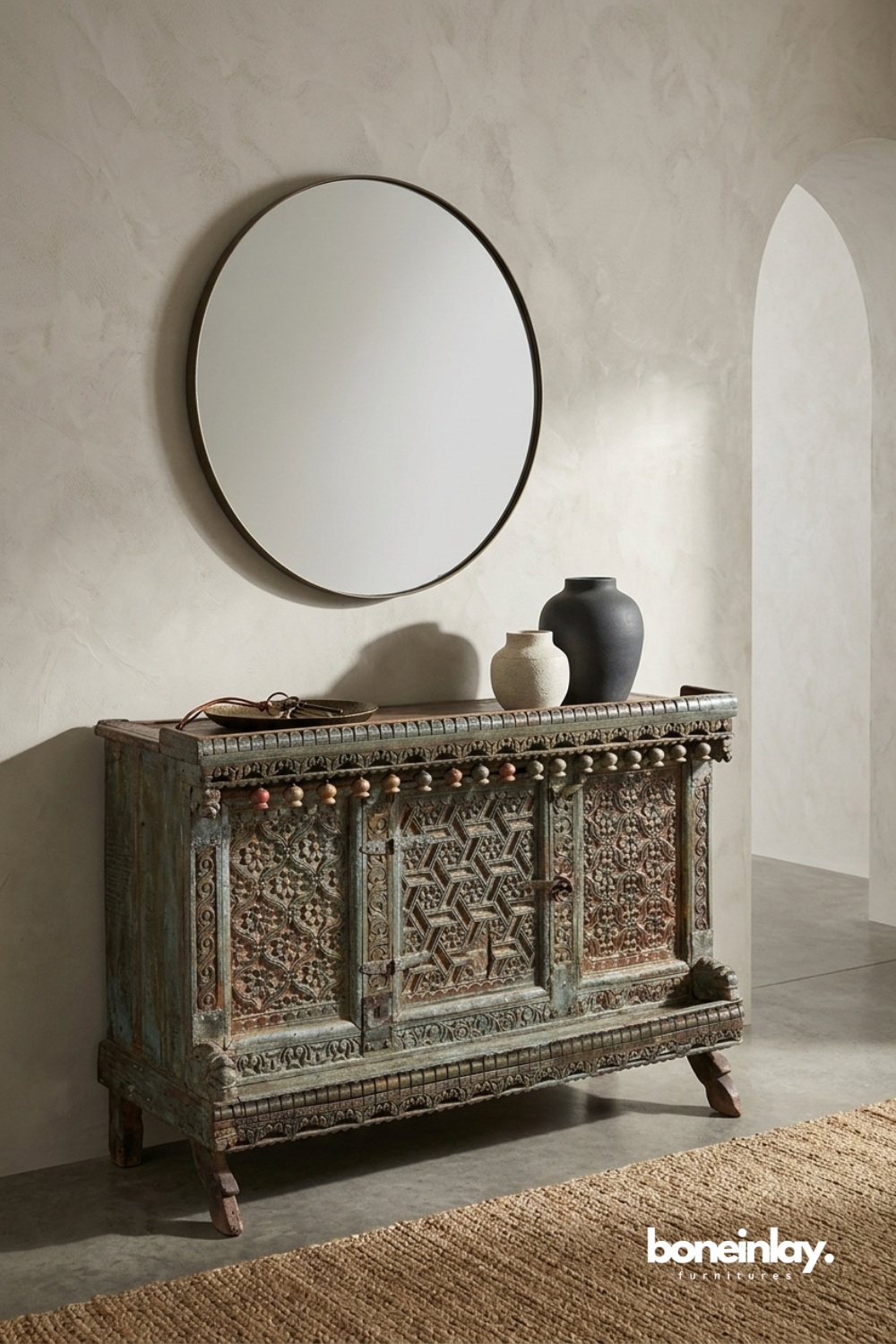 Antique carved wooden cabinet with distressed finish and handcrafted geometric panel detailing