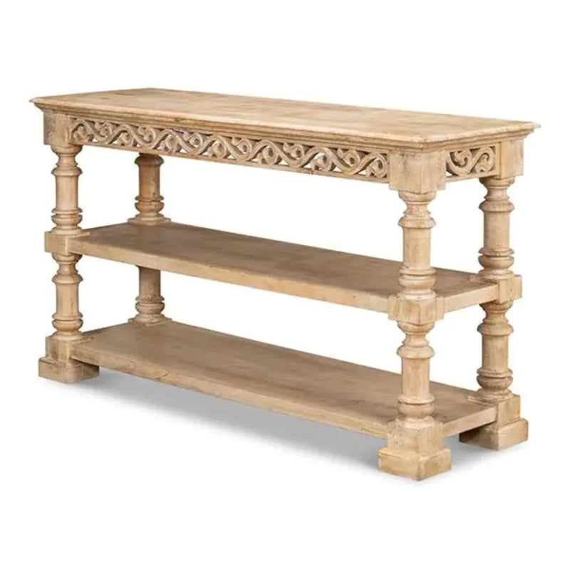 Turned-leg hall table in bleached wood with open fretwork, three-quarter view on a clean white studio background.